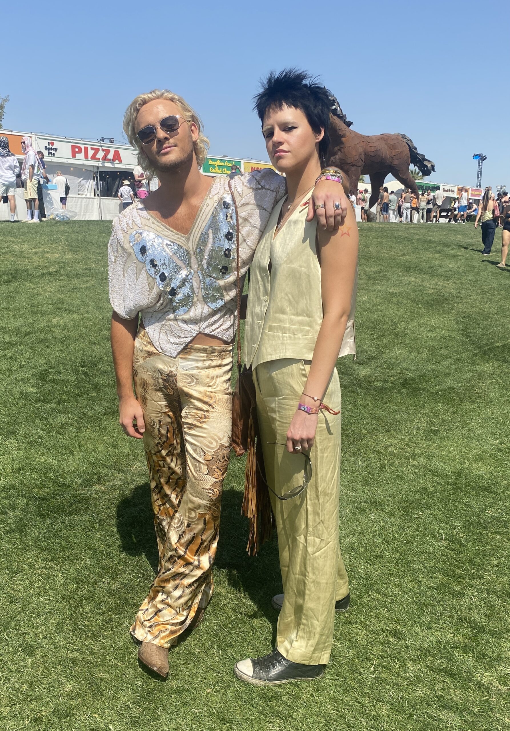 A pair of besties striking a pose at Coachella's Camping Hub.