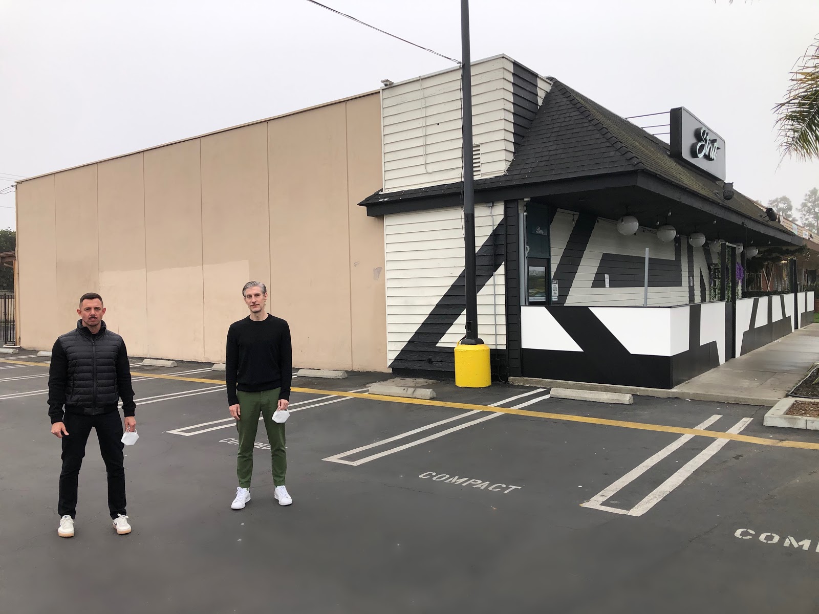 Strut CEO & Founder, Luke Nero (left) and local artist, David Gilmore in front of wall dedicated to mural at Strut, prior to the artwork being created
