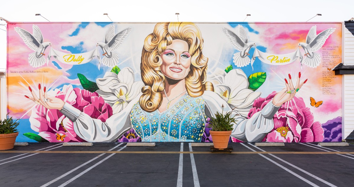 The finished Dolly Parton mural outside Strut