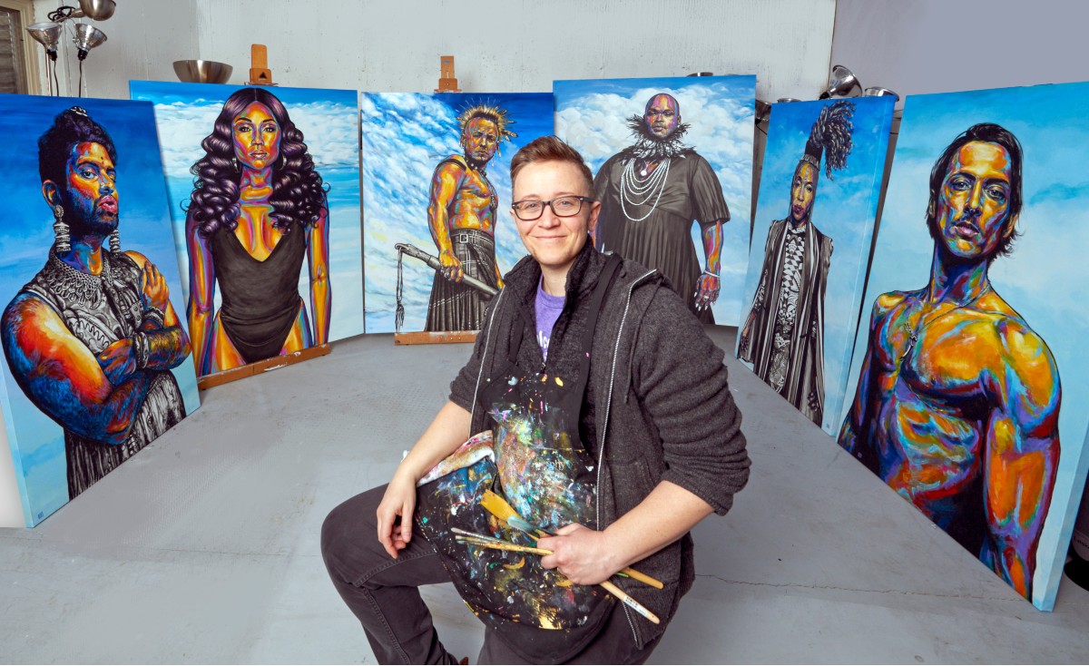 Rae Senarighi with some of his trans portraits